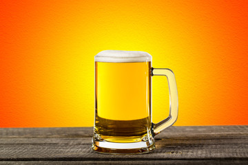 Glass beer on wood background with copyspace