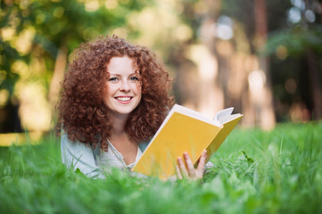 Beautiful girl holding an open book