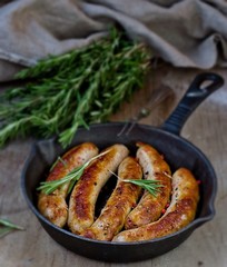 fried sausages on a frying pan