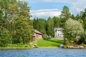 Fototapeta na wymiar Cottage by the lake in rural Finland