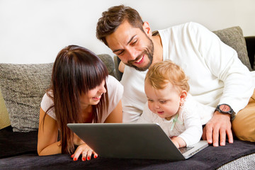 Young, happy family on computer
