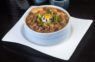 japanese cuisine. beef soup on the background