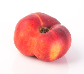 flat peaches (donut peaches) on a background