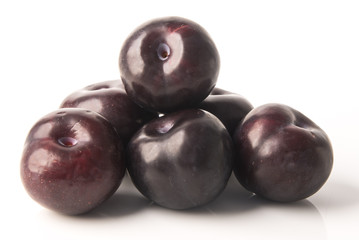 Ripe plum fruit on a background