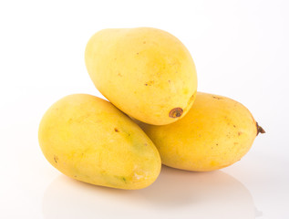 yellow mango fruit on a background