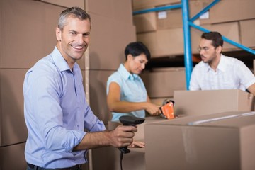 Fototapeta premium Warehouse workers preparing a shipment