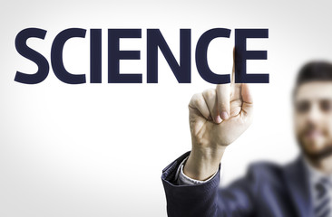 Business man pointing to transparent board with text: Science