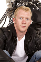 man in black jacket motorcycle behind him