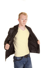 man in white shirt holding black jacket open