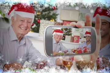 Hand holding smartphone showing photo