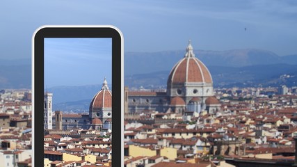 Fototapeta na wymiar Tablet, smartphone taking picture of Florence Italy