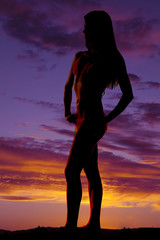 silhouette of woman in bikini side looking to side