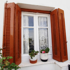Athens Greece, vintage house window and flower pots
