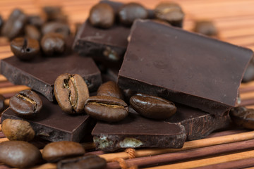 chocolate and coffee beans on brown bamboo  background
