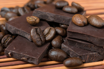 chocolate and coffee beans on brown bamboo  background
