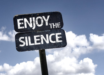 Enjoy The Silence sign with clouds and sky background