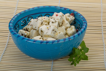 Cheese with spices and oil