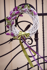 White wicker wreath decorated