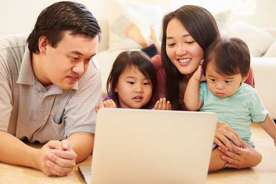 Family Watching Movie On Laptop At Home