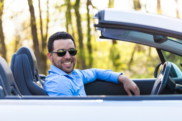 Young black latin american driver  driving his new car