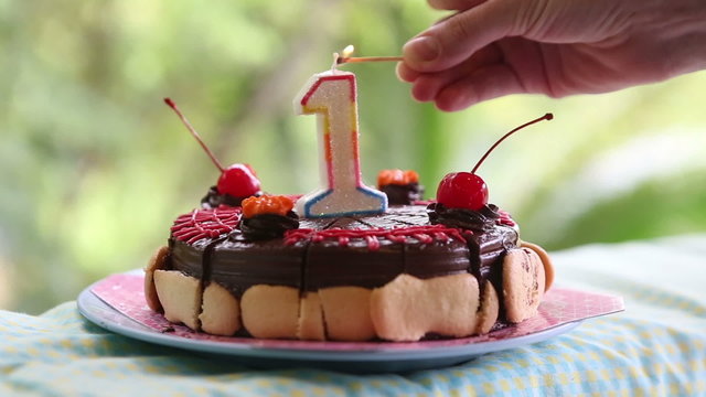 cake for my birthday for a year with cherries with candle
