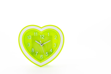 Heart green clock isolated on white background