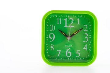 Green clock isolated on white background