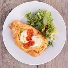 baked bread with cheese, tomato