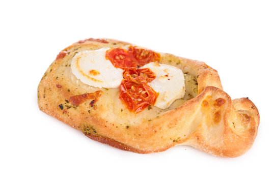 baked bread with cheese, tomato and pesto sauce