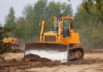 Obraz na płótnie Canvas Industrial Technologies: bulldozer on a construction site