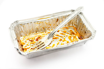 Empty aluminium foil tray after eat on a white background