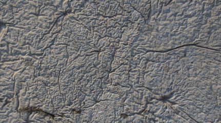 Textured concrete floor with light and shadow