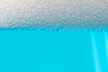 Detail bubbles in blue liquid.