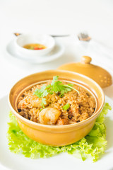 fried rice with shrimp and sausage in clay pot