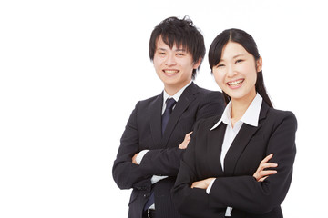 腕を組んで笑うビジネスウーマンとビジネスマン