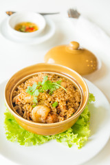 fried rice with shrimp and sausage in clay pot
