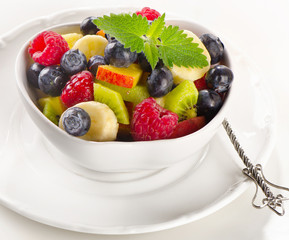 Fresh  fruit salad in a white bowl