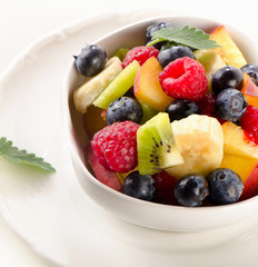 Fresh healthy fruit salad in a white bowl