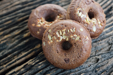 Group of small donuts on a wooden board