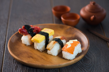 various sushis with wood background