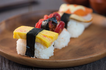 various sushis with wood background