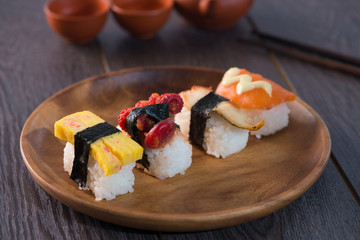 various sushis with wood background