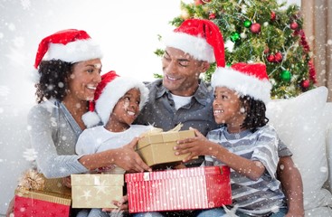 Composite image of family celebrating christmas at home