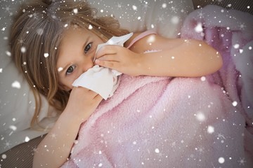 Composite image of girl suffering from cold as she lies in bed - obrazy, fototapety, plakaty