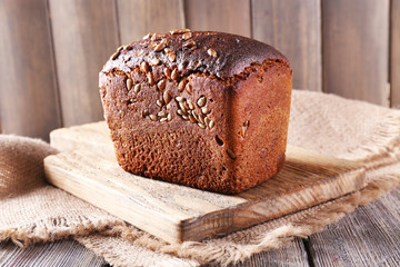 Fresh bread on wooden table, close up