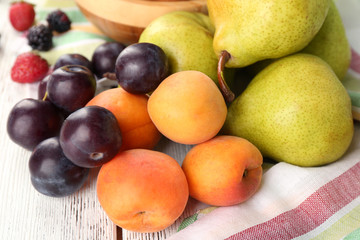Naklejka na ściany i meble Ripe fruits and berries on table close up