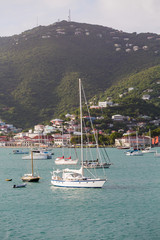 Fototapeta na wymiar White Sailboats in St Thomas Bay Vertical