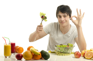 Man having a table full of organic food,juices, organic smoothie
