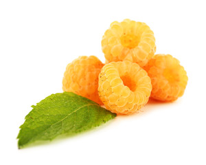 Raspberries and mint leaves isolated on white