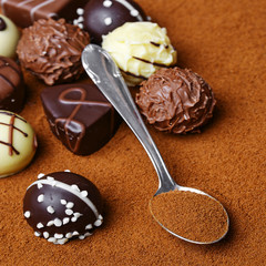 chocolate pralines on chocolate background